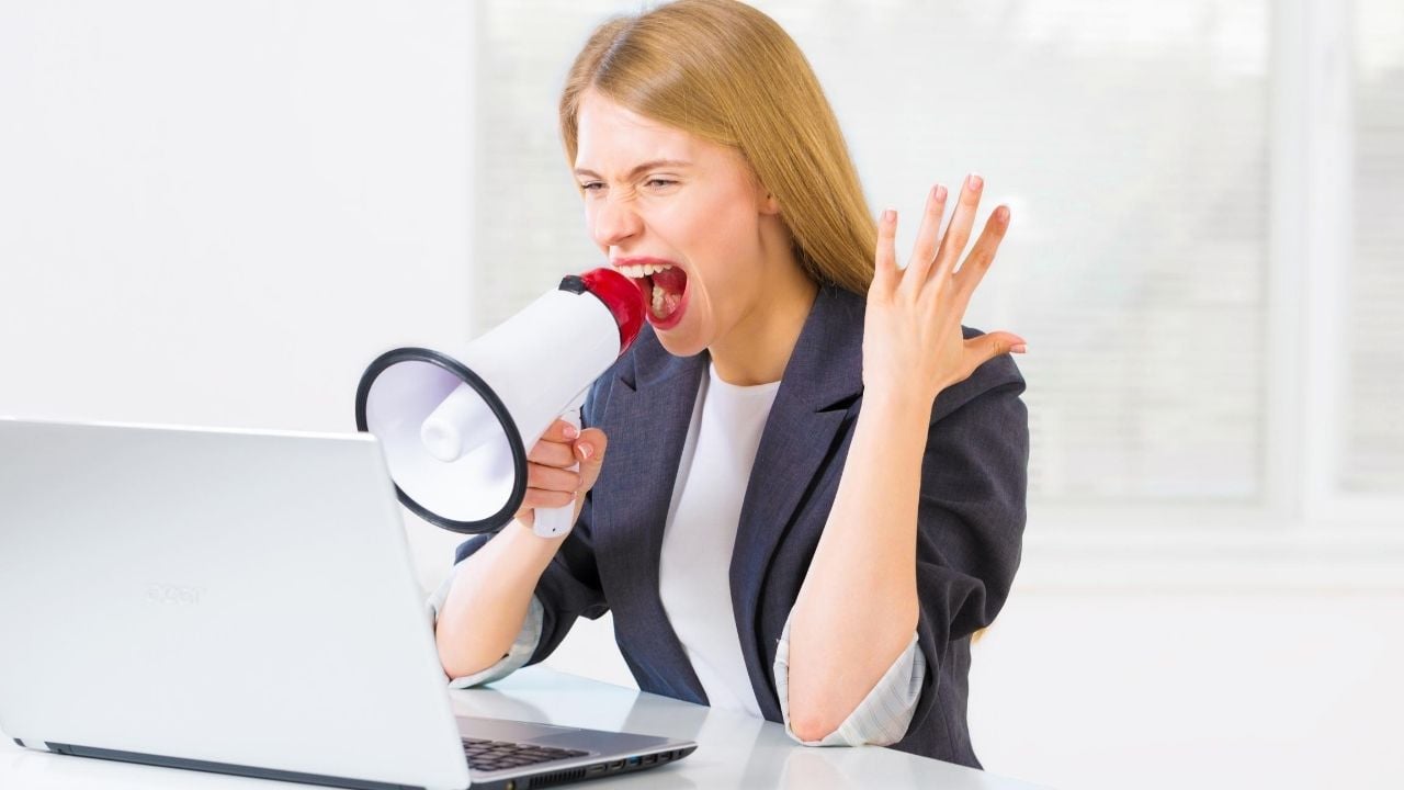 woman using loudspeaker laptop